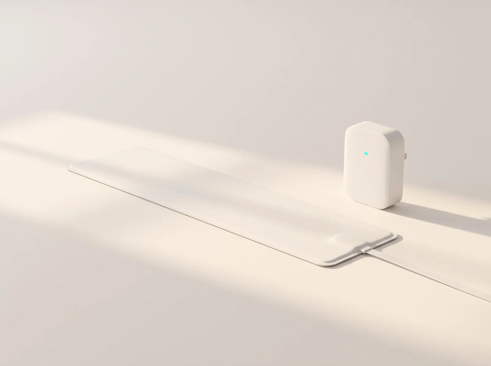The InvisiCare Starter Bundle: an ultra-thin white sensor pad and the compact Smart Hub with its teal status light